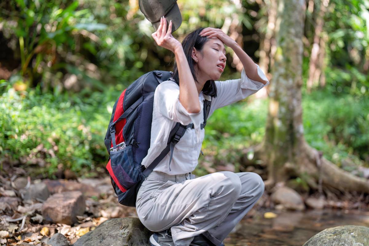 Backpack tourist travel hiking outdoor adventure use water stream from mountain washing hand