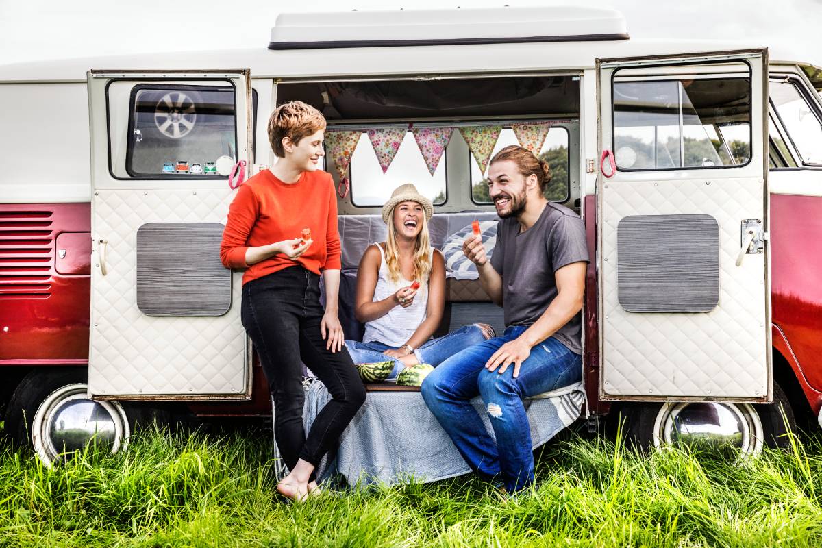 happy-friends-having-picnic-in-a-van-parked-on-fie-2024-09-15-14-40-42-utc (1)
